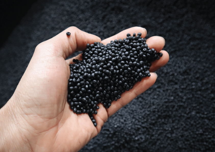 Plastic-granules-on-hand-01