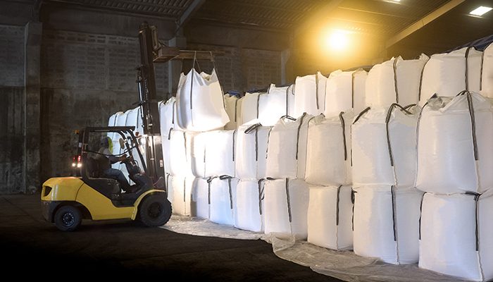 Soda ash in jumbo bags are store in warehouse and handling by forklift; Shutterstock ID 708809161; purchase_order: FIBC PRE-ELEC; job: ; client: ; other: