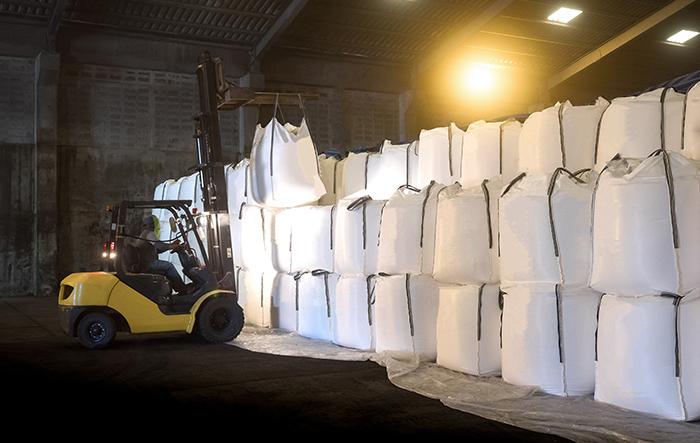 Soda ash in jumbo bags are store in warehouse and handling by forklift; Shutterstock ID 708809161; purchase_order: FIBC PRE-ELEC; job: ; client: ; other: